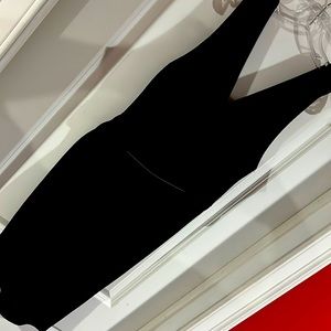 Black cocktail dress with gold belt